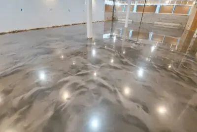 Polished concrete floor with epoxy finish in a spacious New York commercial space by South Side Concrete Polishing and Epoxy Flooring Services.